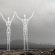 Illustration for article titled These Beautiful Giant Sculptures Support Power Lines With Style